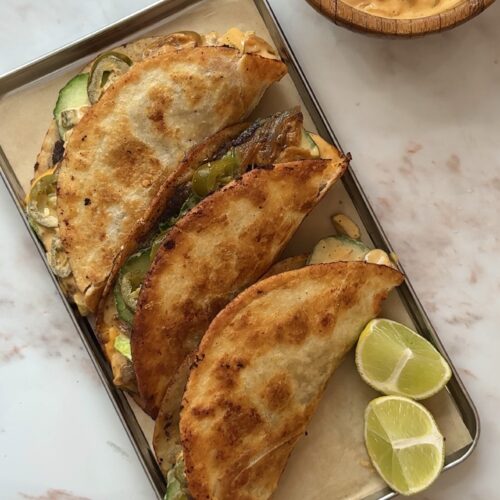 Crispy smash burger tacos with melted cheese, caramelised onions and cheeseburger sauce
