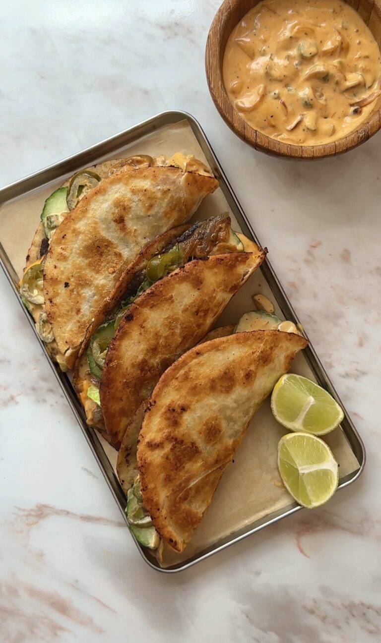 Crispy smash burger tacos with melted cheese, caramelised onions and cheeseburger sauce