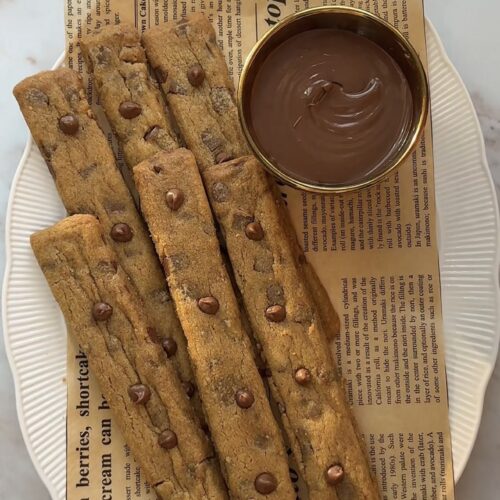 Golden chocolate chip cookie fries arranged like French fries with mini chocolate chips