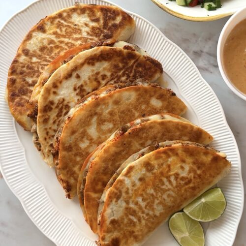 Crispy golden beef tacos filled with seasoned mince, melted cheese and fresh salsa