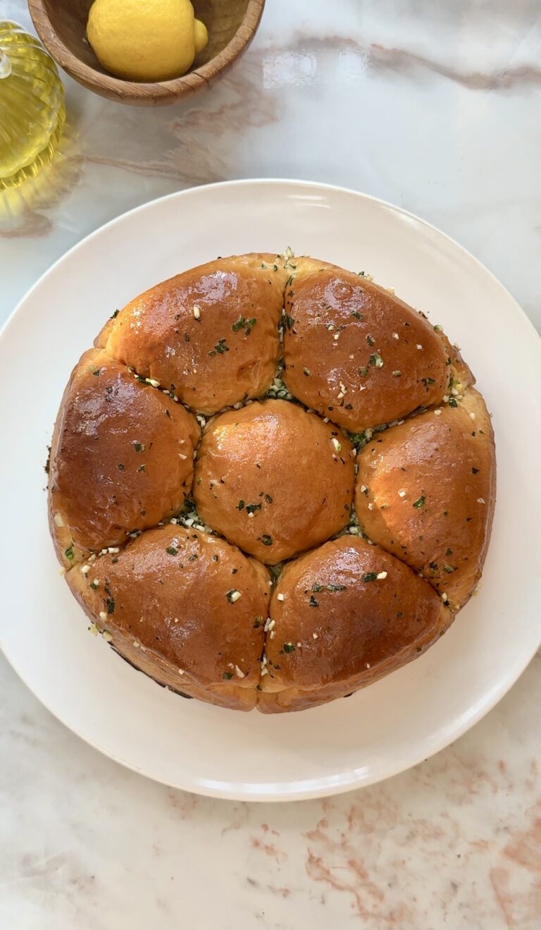 Soft fluffy Japanese milk bread rolls brushed with garlic butter in a springform pan